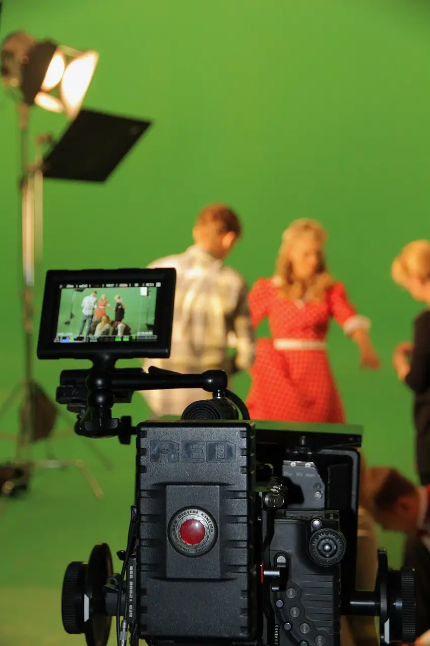 Video crew filming a commercial on a green screen set