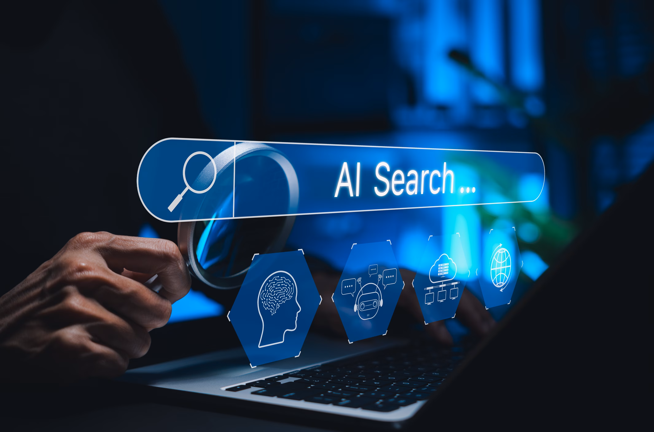 Person using a laptop with an AI-powered search bar, illustrating how AI search is changing SEO